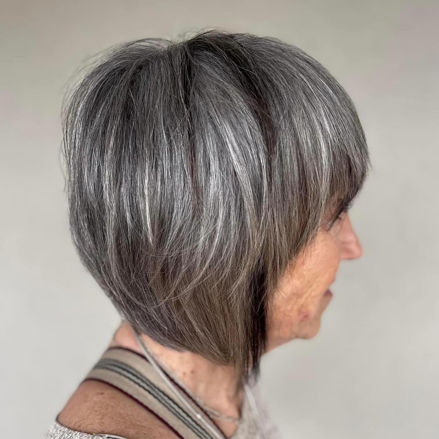Sleek Stacked Salt and Pepper Bob Haircut Side Profile