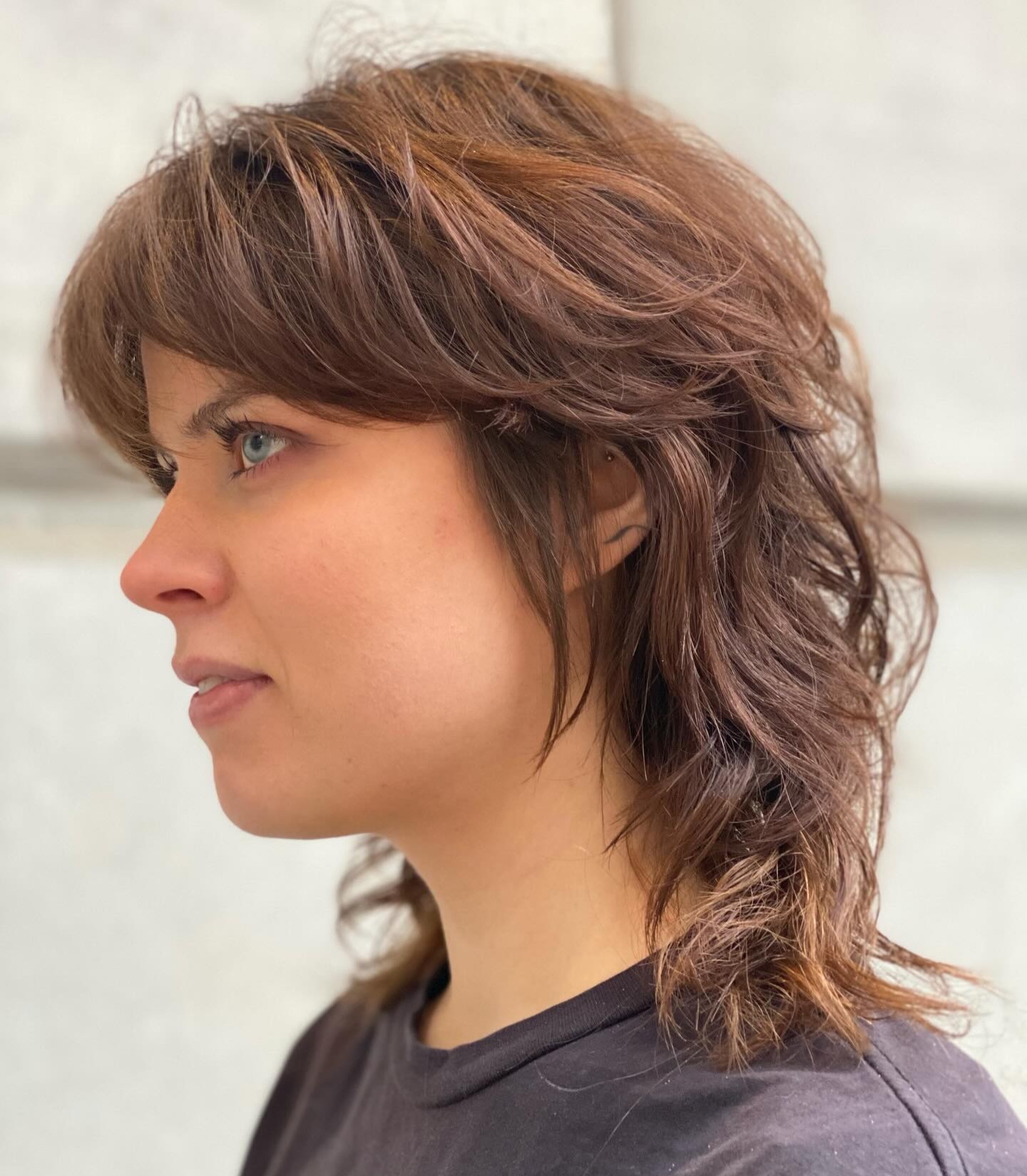 Side Profile of Textured Light Brown Shaggy Haircut