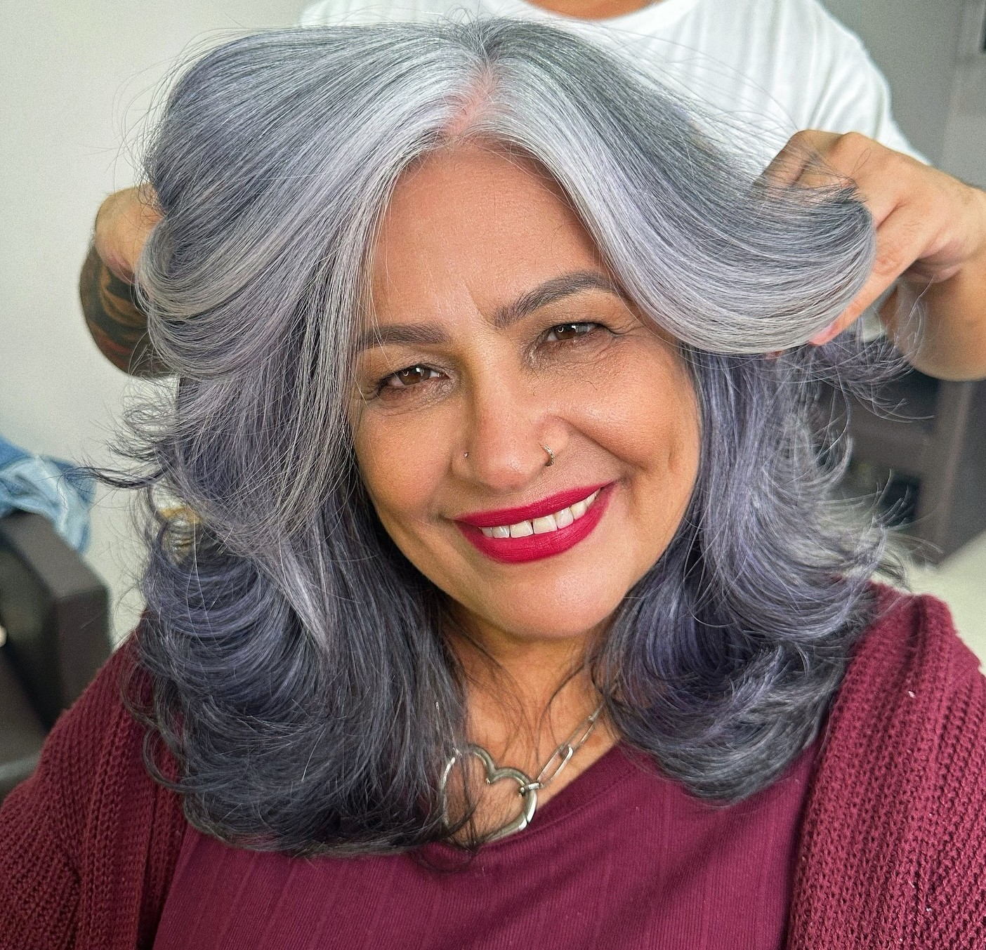 Voluminous Layered Grey Haircut with Curtain Bangs