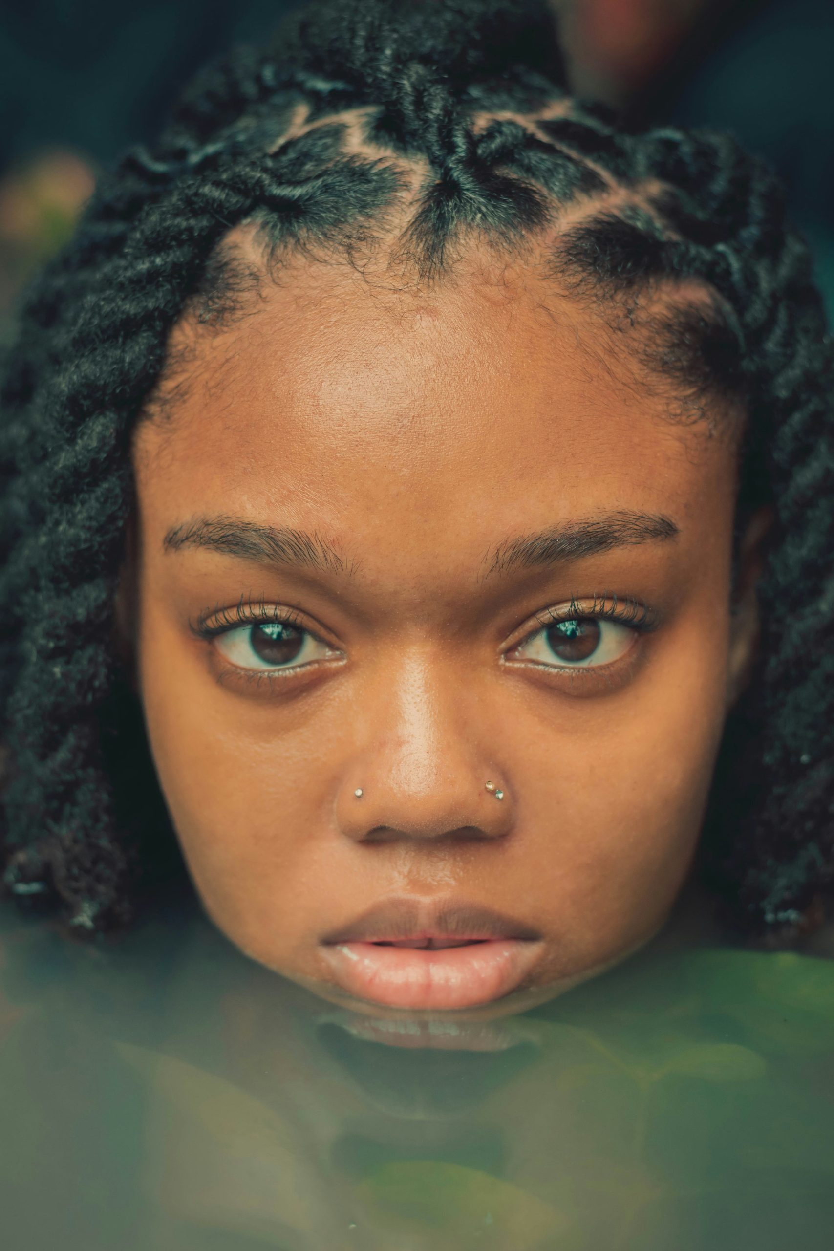Barrel Twist Locs with Coiled Rope-Like Texture on Long Natural Hair