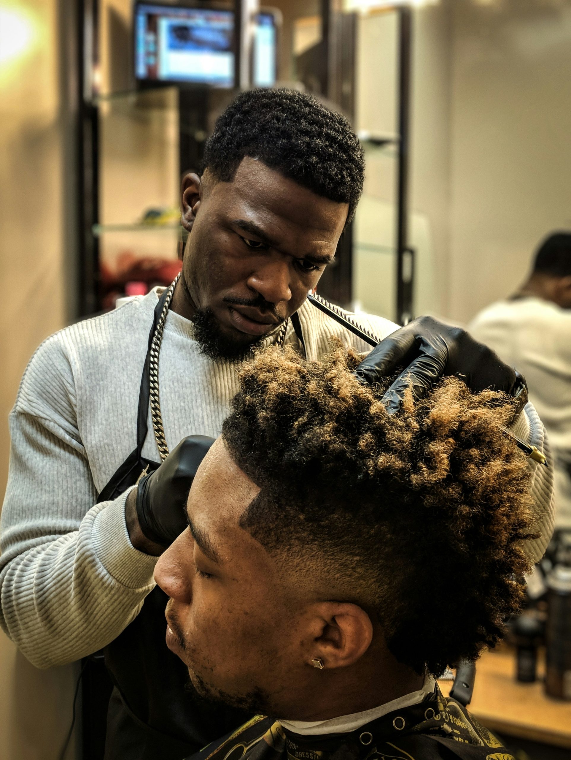 Boosie Fade Haircut with Sharp Lineup and Bald Skin Fade on Black Man with Short Natural Top