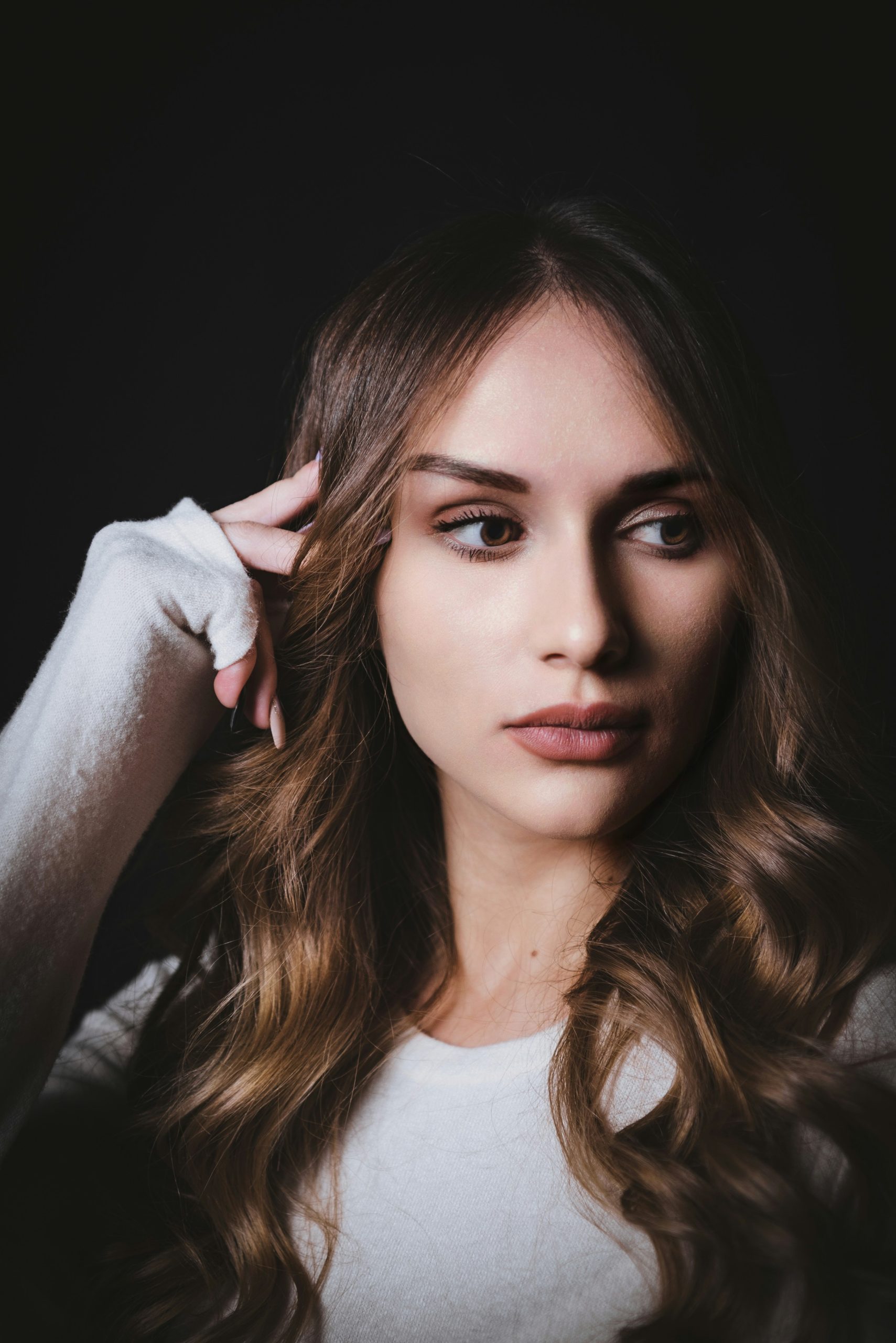 Bronde Hair Color with Blended Golden and Brunette Tones on Long Wavy Hair