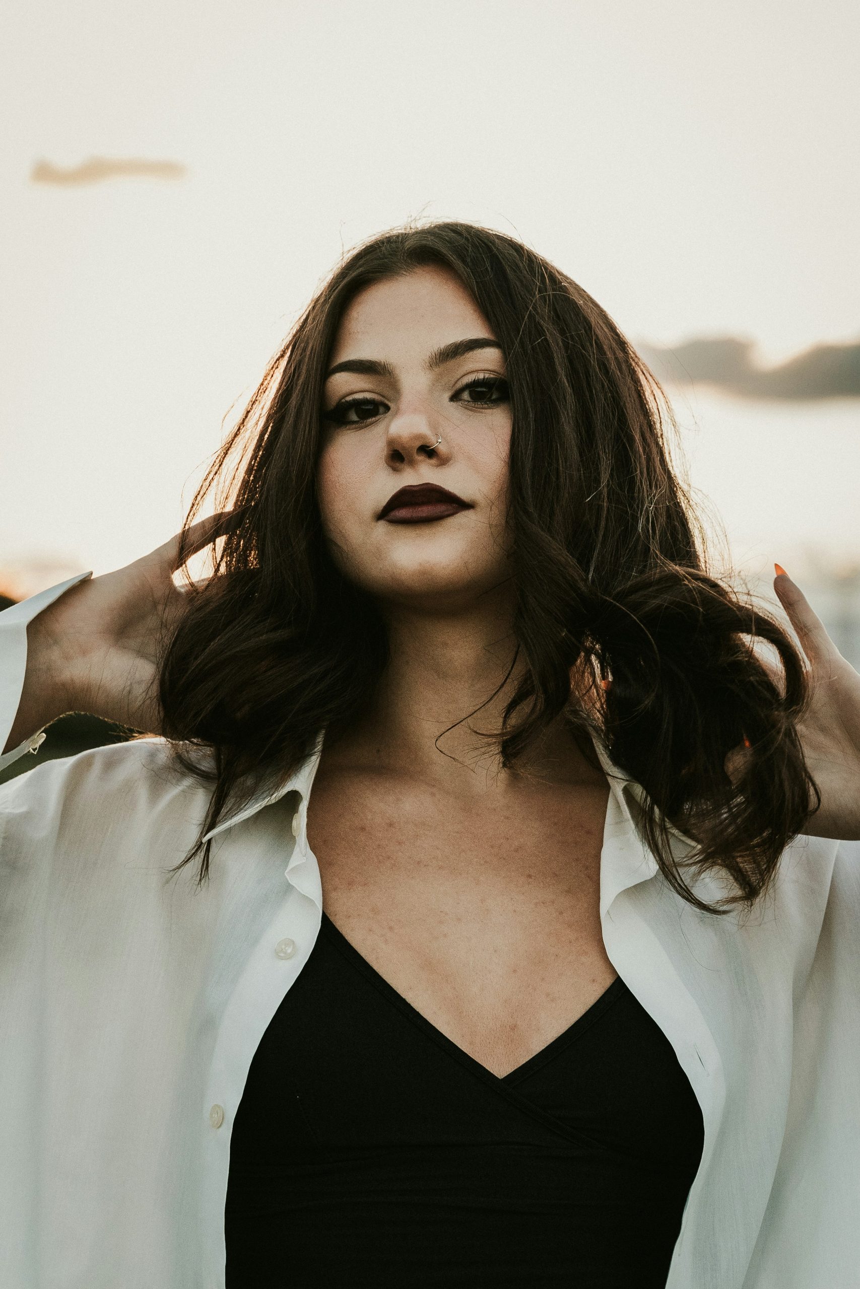 Dark Brown Hair in a Glossy Espresso Shade with Soft Face-Framing Pieces on Straight Mid-Length Hair