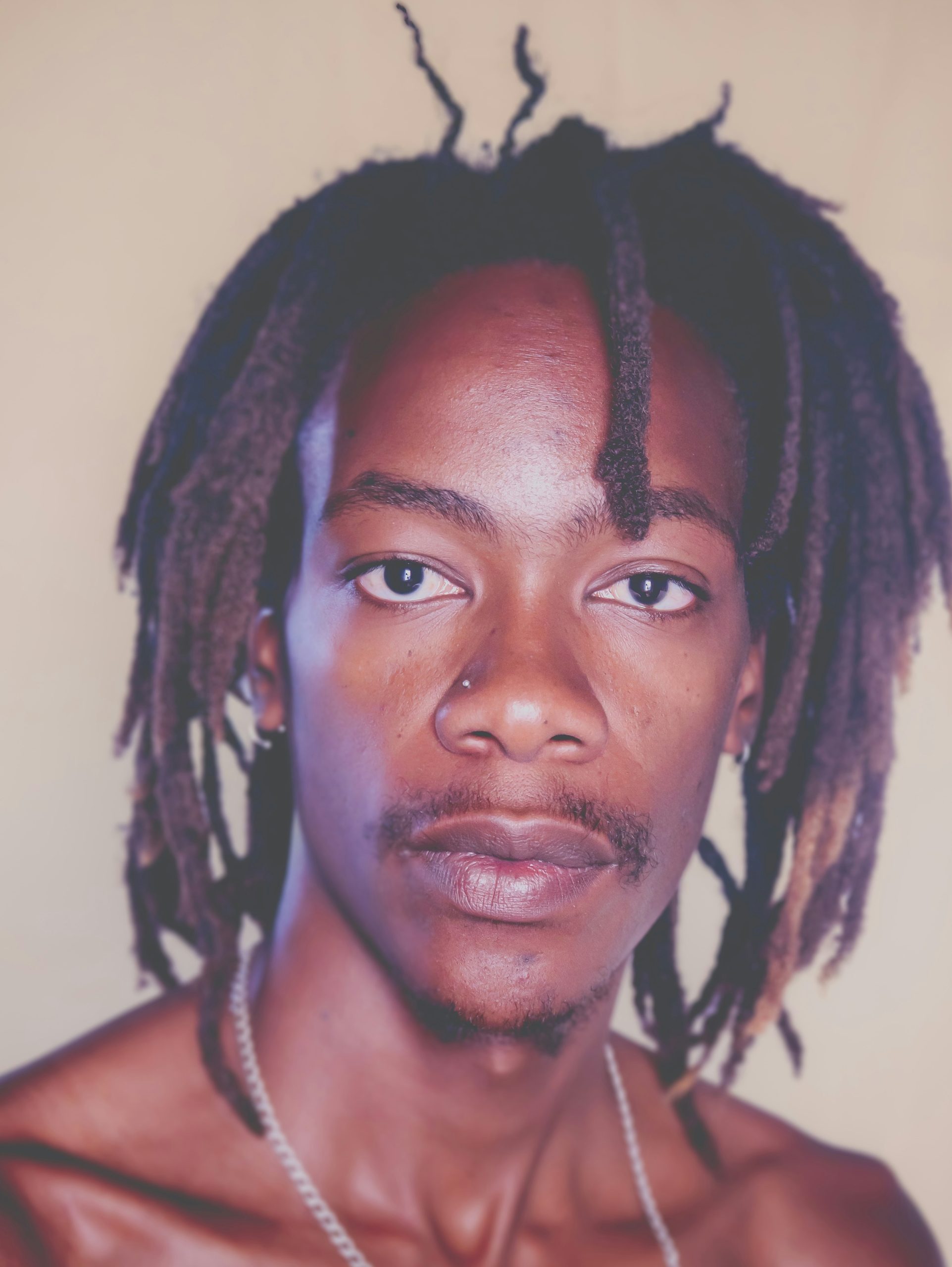 Mature Freeform Dreads with Natural Uneven Shapes on a Dark-Haired Man