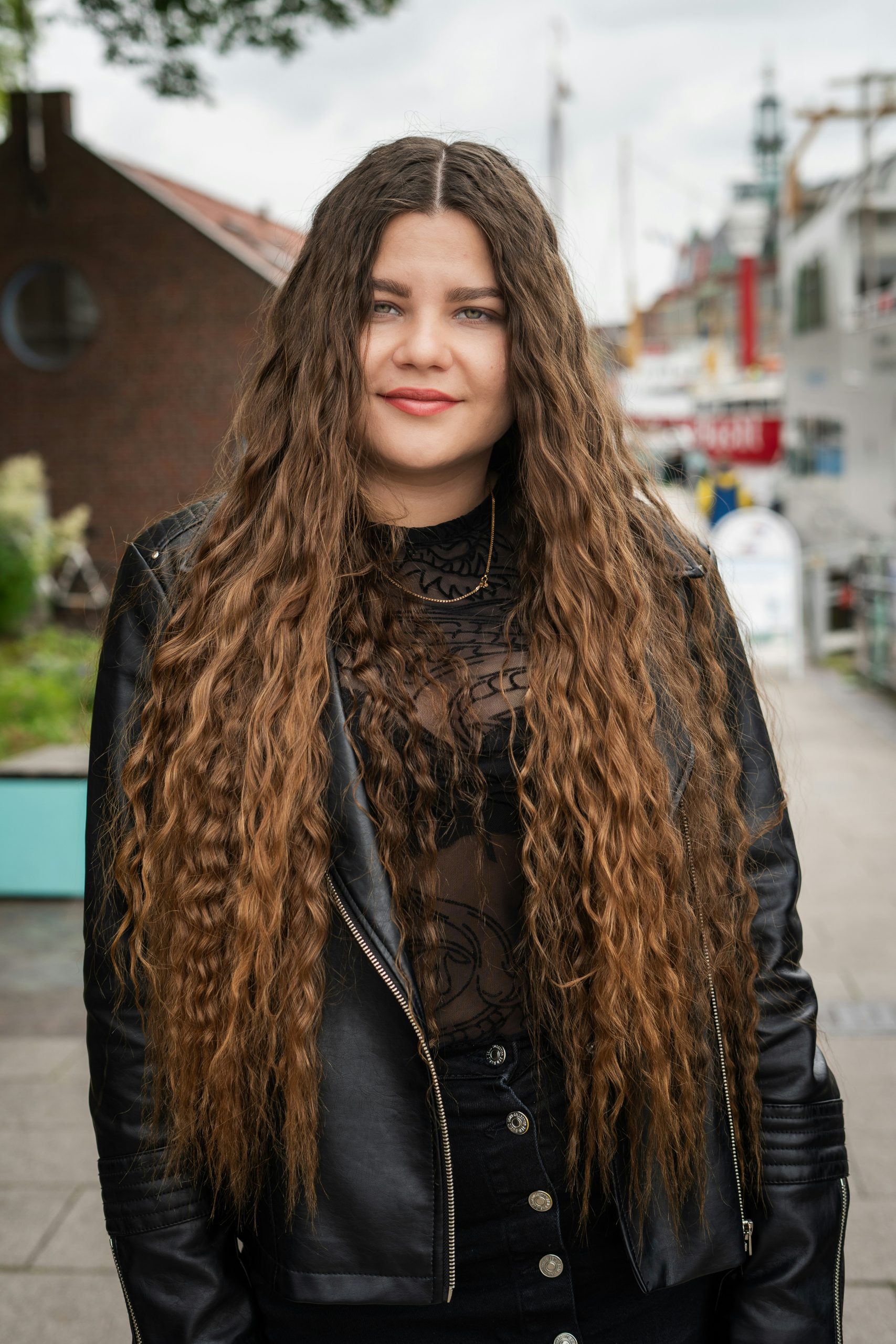 Long Layers with Face-Framing Pieces Starting at the Cheekbones on Wavy Light Brown Hair