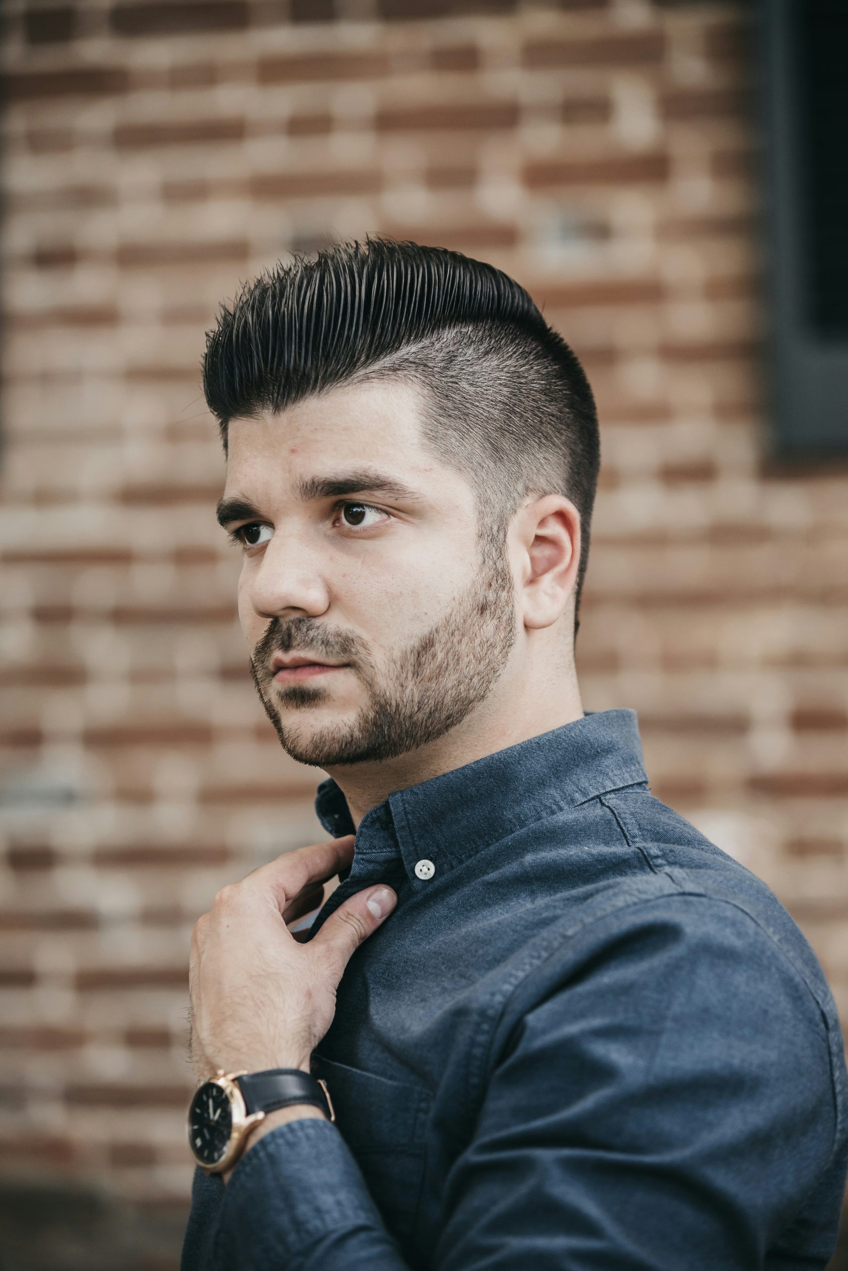Low Taper Blowout on a Man with Voluminous Blown-Out Straight Hair and a Subtle Taper around the Ears