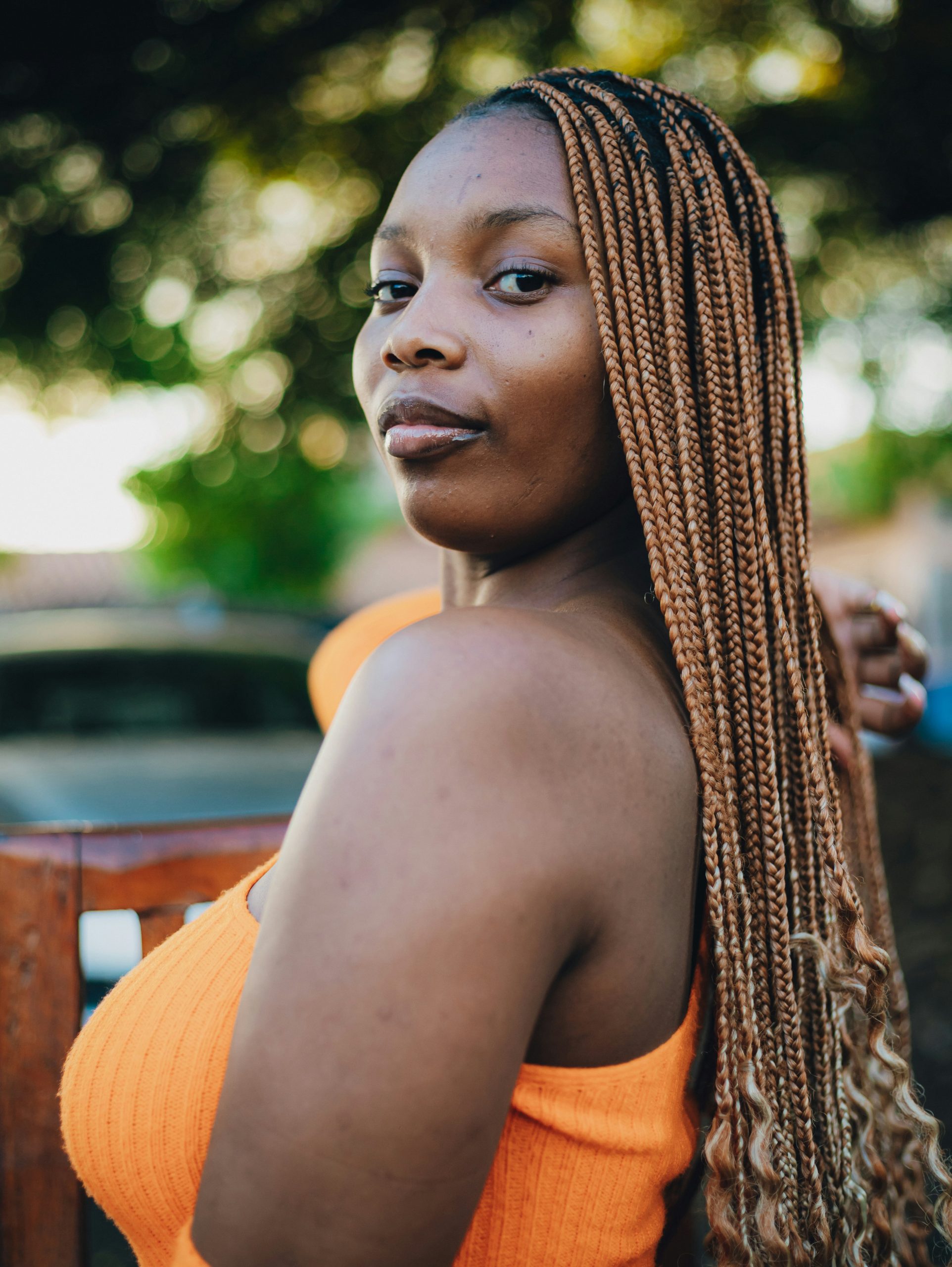 Medium Knotless Braids in Mid-Back Length with a Natural Feed-In Hairline
