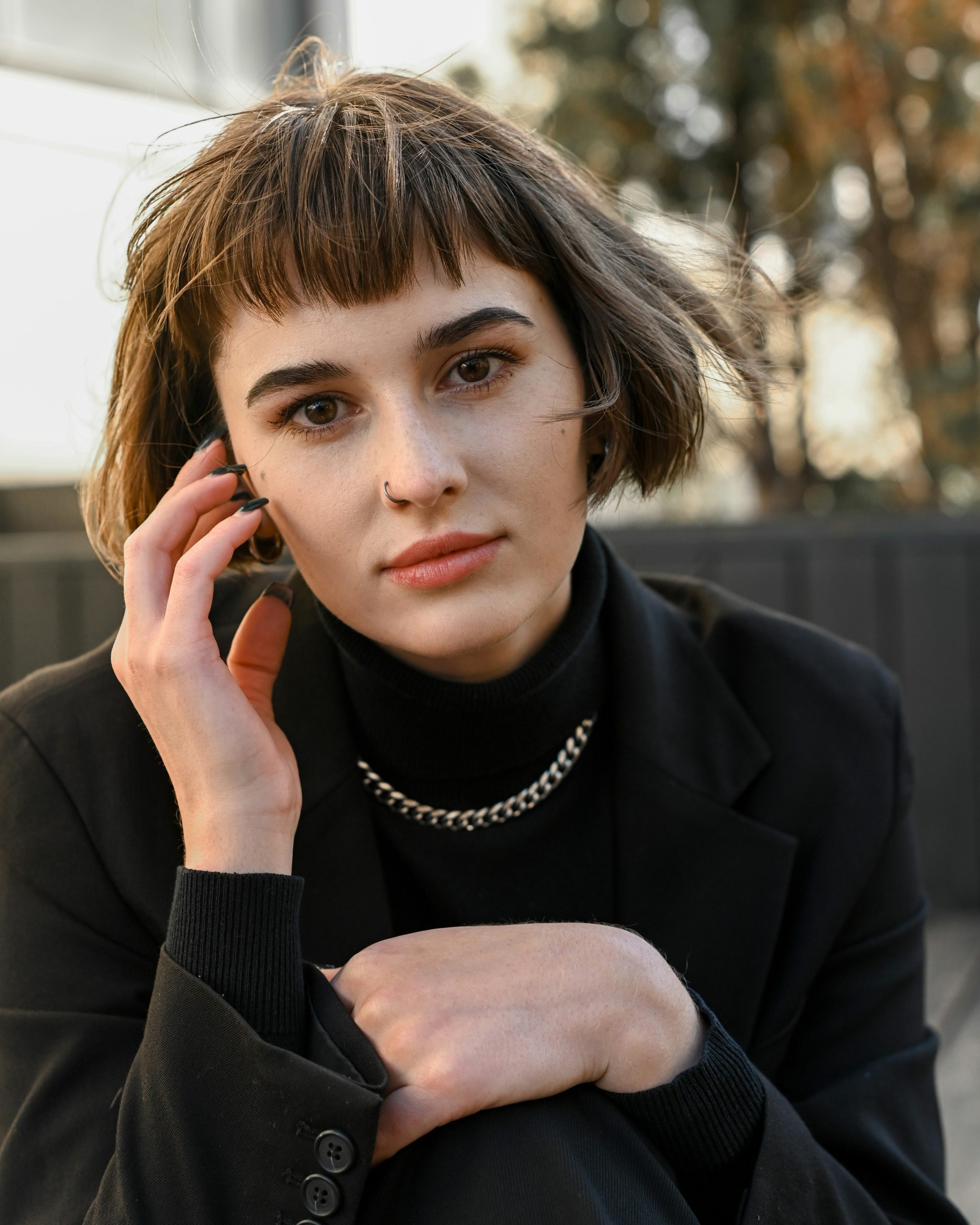 Short Curtain Bangs Parted in the Middle and Cropped Above the Brows