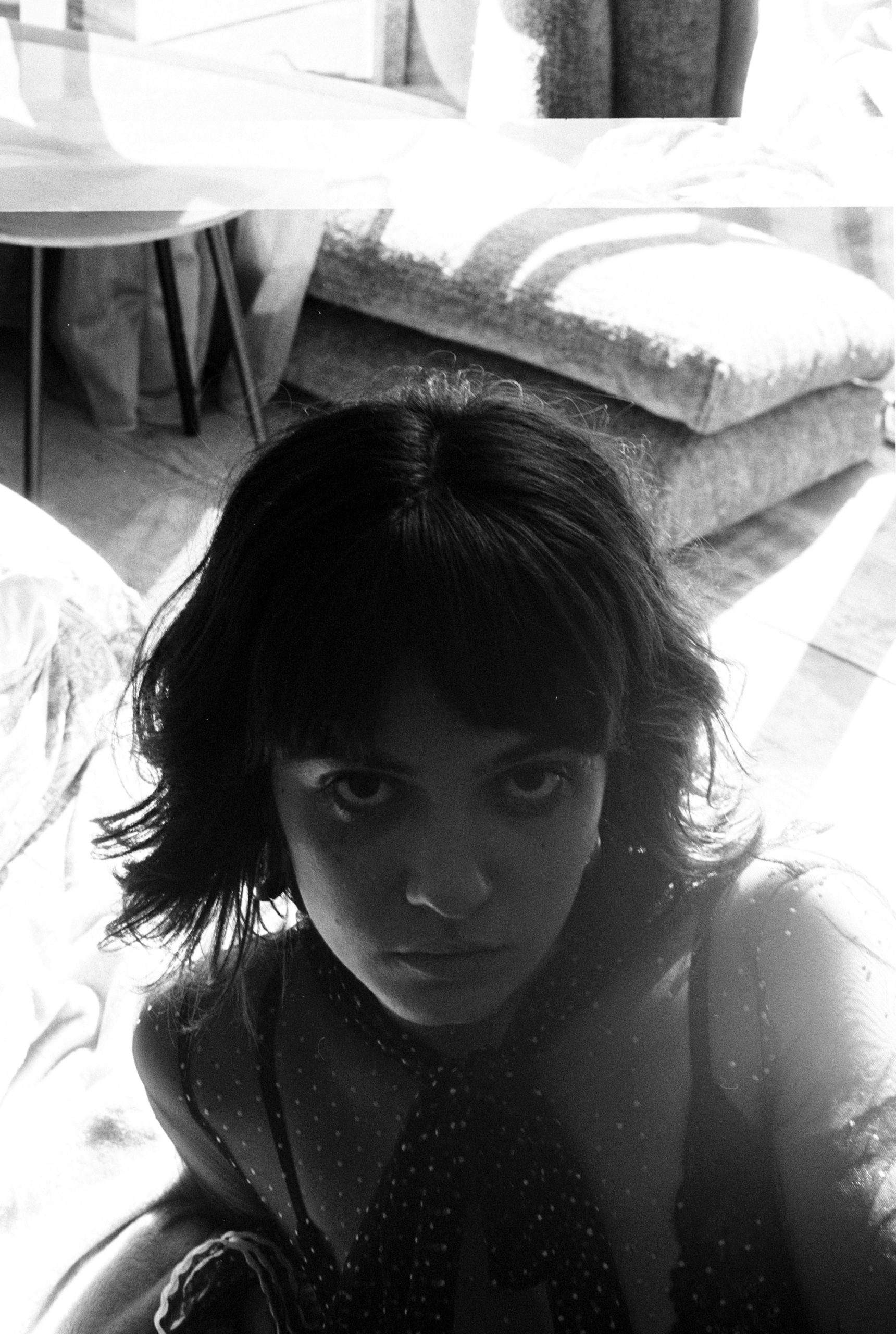 See-Through Bangs with Sheer Wispy Fringe Grazing the Brows on Medium Brunette Hair