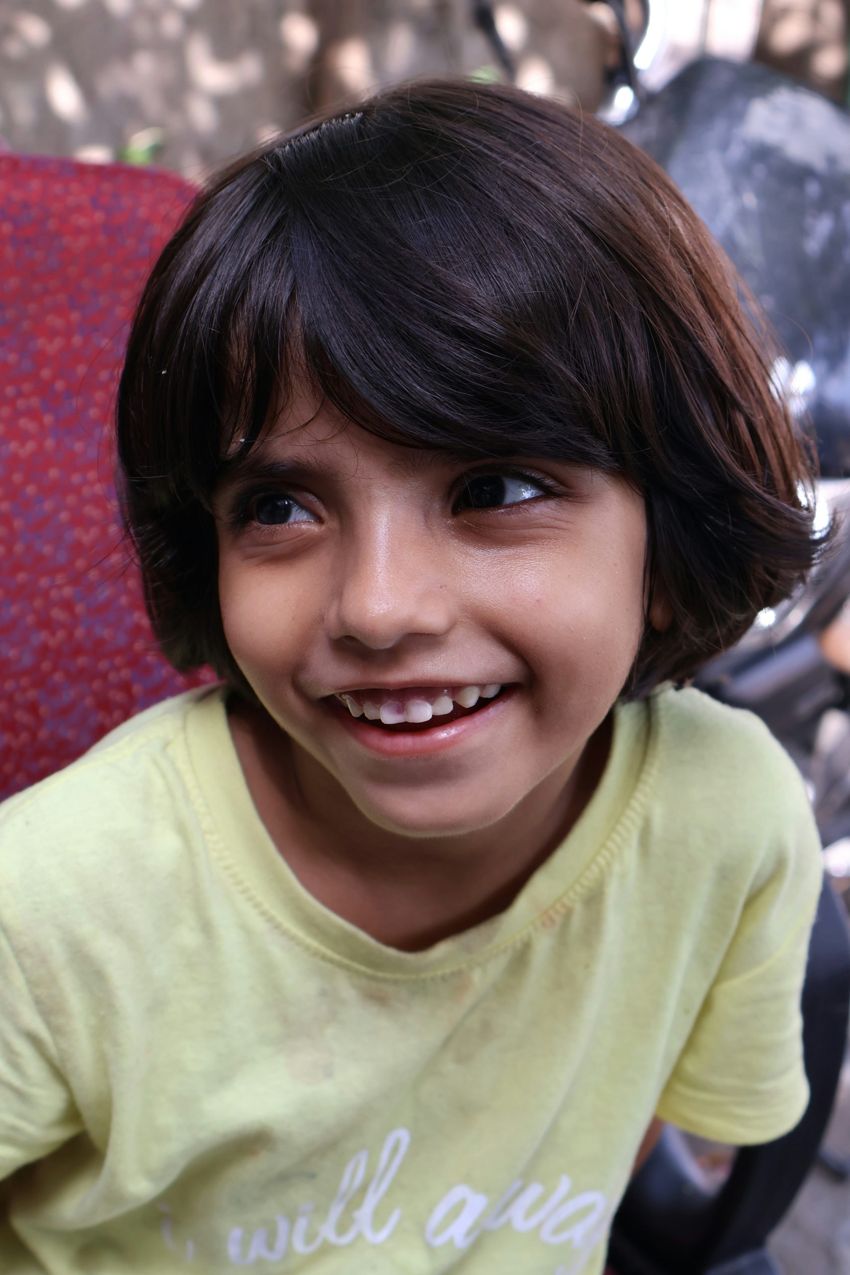 Short Bob Haircut for a Young Girl with Soft Natural Waves and Side Bangs