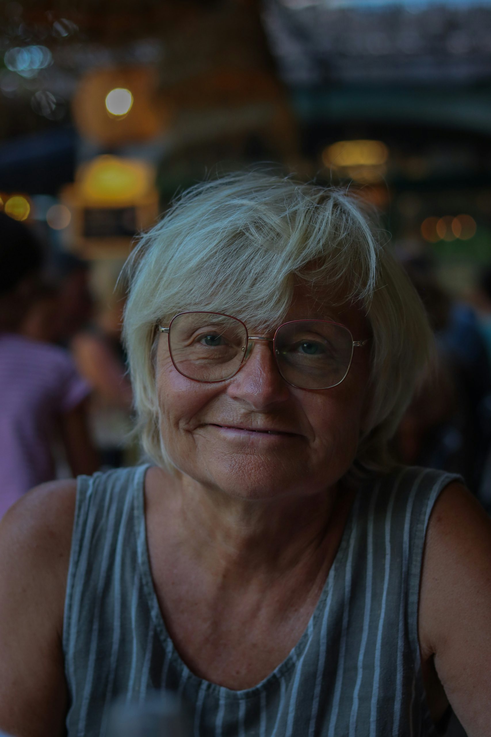 Short Shaggy Haircut for a Woman Over 60 with Soft Choppy Layers on Silver Hair