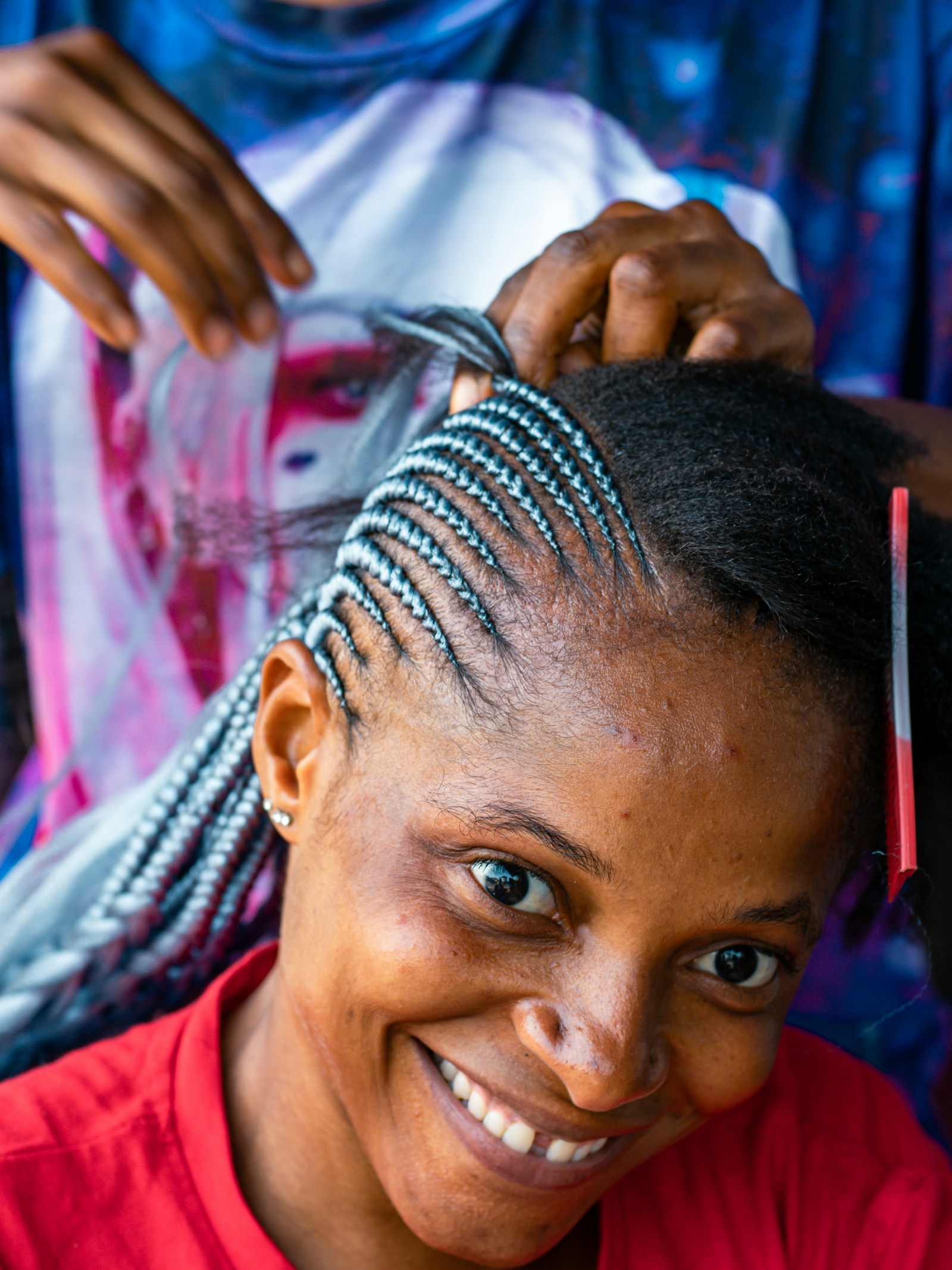 Tell Stylist Maintenance Level Woman in a Salon Chair Talking with Her Stylist about Haircut Maintenance and Daily Styling Time
