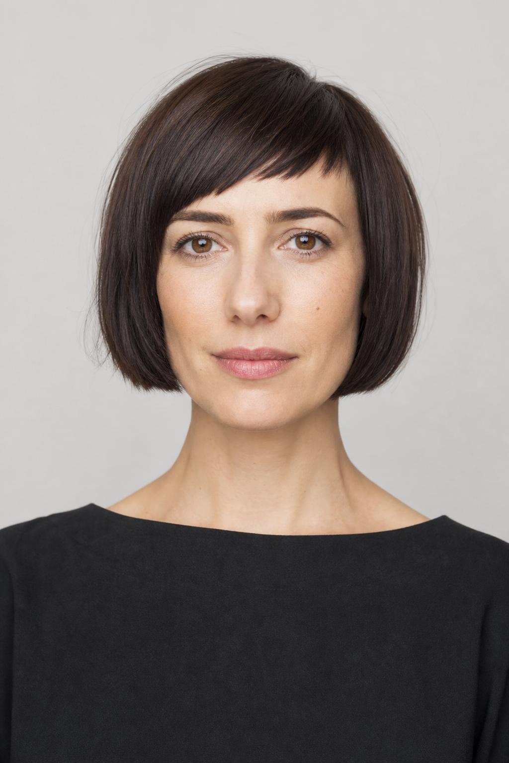 Chin-Length French Bob with a Tilted Micro Fringe on Dark Brown Hair