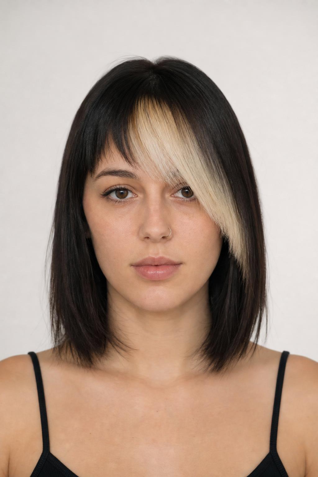 Platinum Blonde Angled Fringe Against Naturally Dark Shoulder-Length Hair