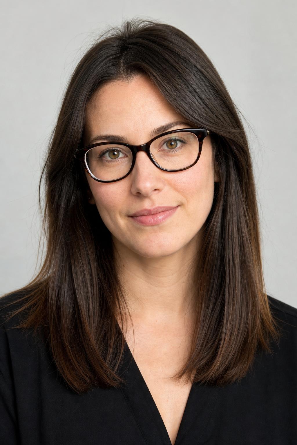 Grown-Out Fringe Pieces Tucked Behind Glasses Temple Arms on Dark Hair