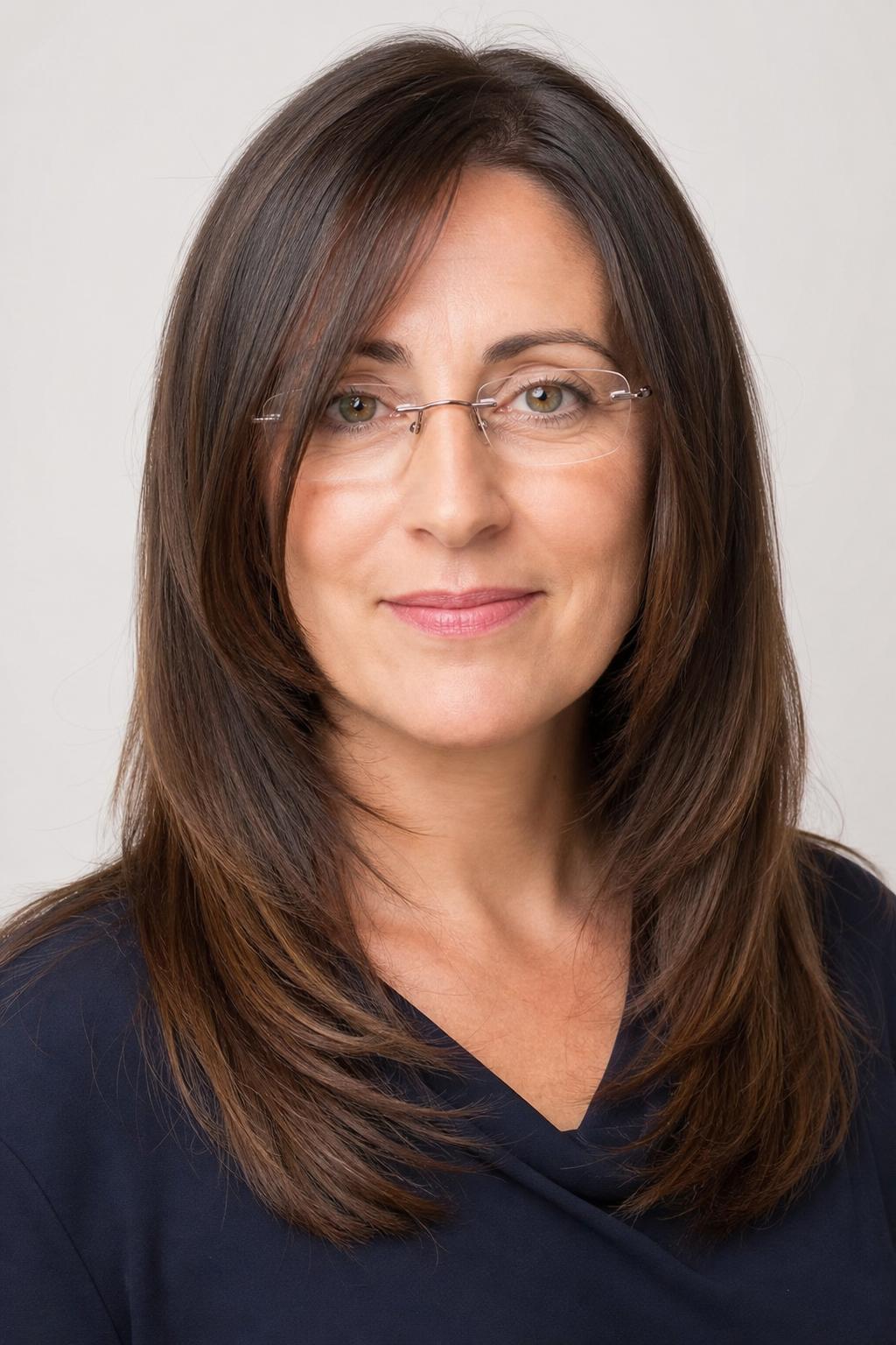 Cheekbone-Length Face-Framing Pieces with Rimless Glasses on Dark Hair