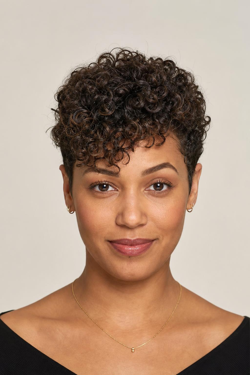 Curly Pixie Shaped Forward with Cream-Defined Volume on Top