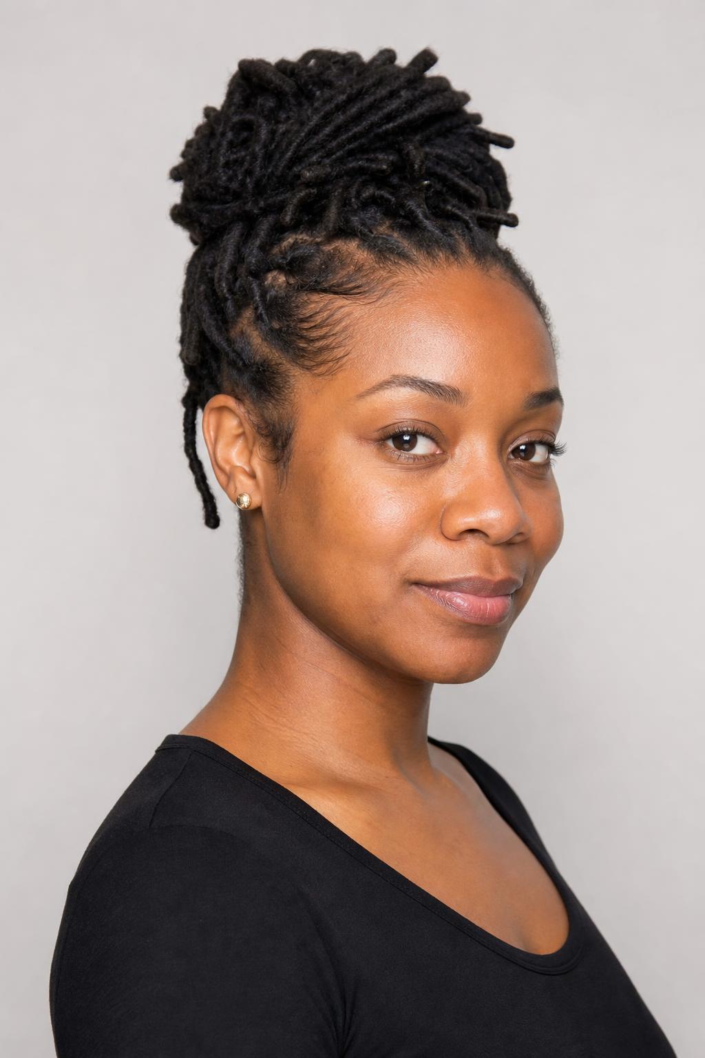 Mature Locs Gathered into a High Bun Secured at the Crown