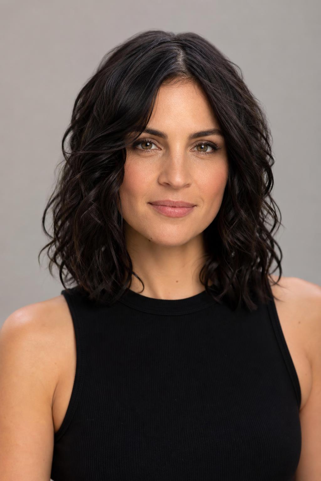 Scrunched Defined Waves with a Soft Conditioned Finish on Dark Hair