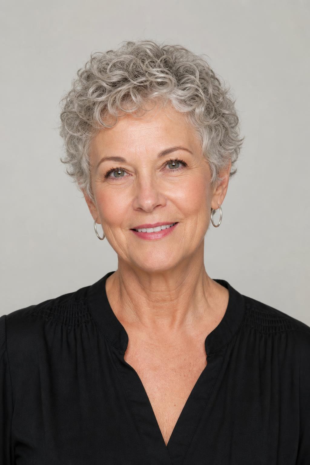 Short Curly Crop with Softly Point-Cut Tips on Fine Light Gray Curls