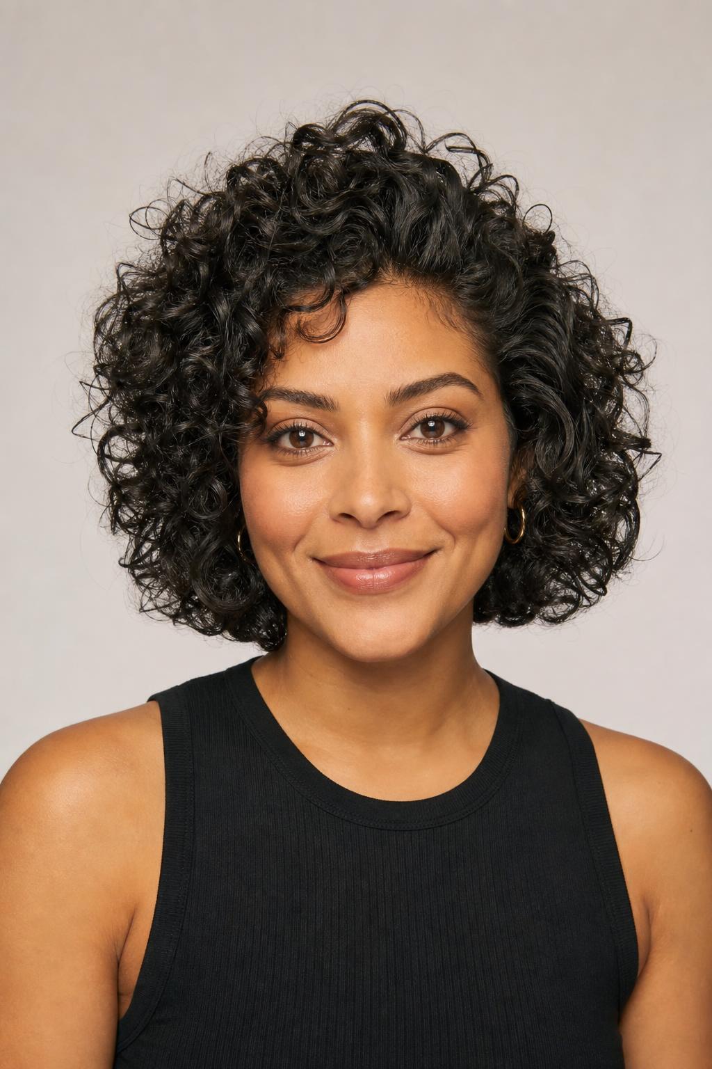 Curly Bob With Shorter Crown Layers That Expand Upward