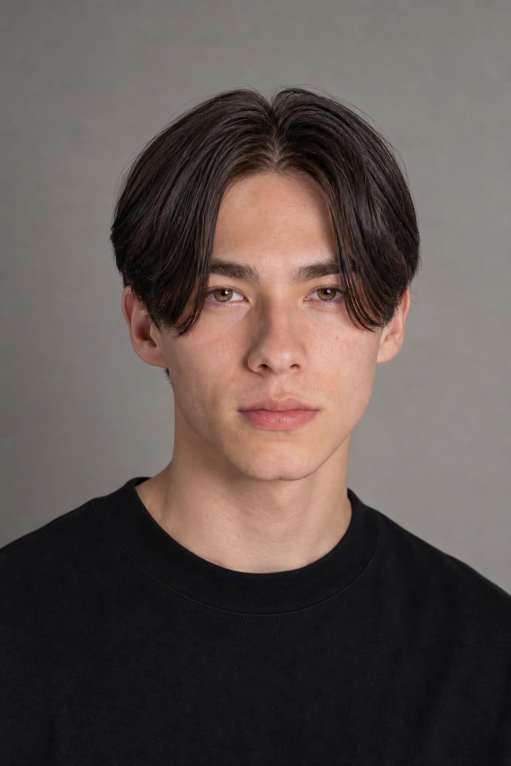 Low Taper Sides Under a Center-Parted Fringe Ending at the Cheekbones