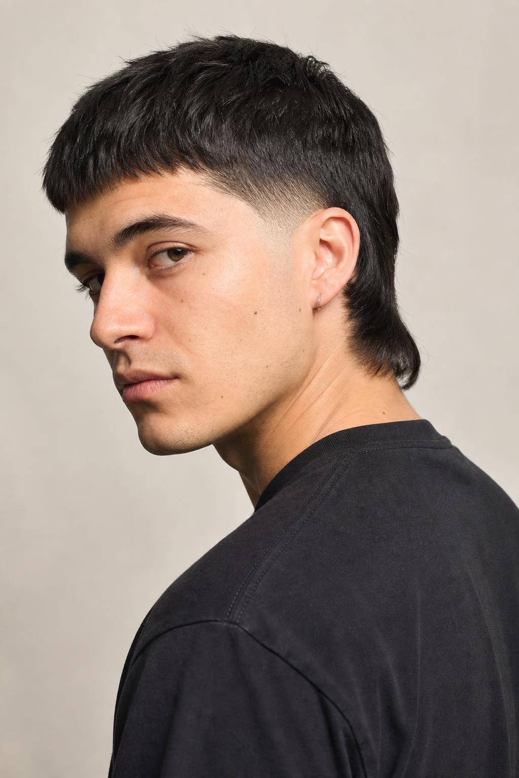 Mid Fade Mullet with Cropped Sides and a Collar-Length Nape Section