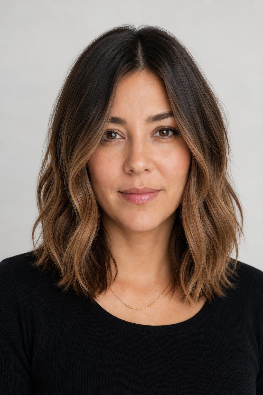 Shoulder-Length Hair with a Deeper Lived-In Root Melting into Lighter Ends