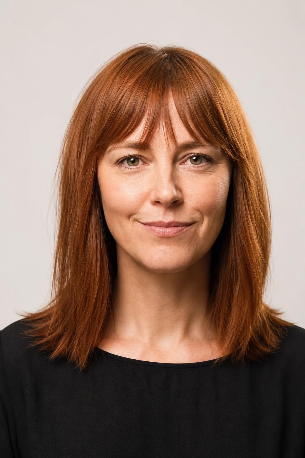 Wispy Bottleneck Bangs Narrow at the Center on Fine Straight Auburn Hair