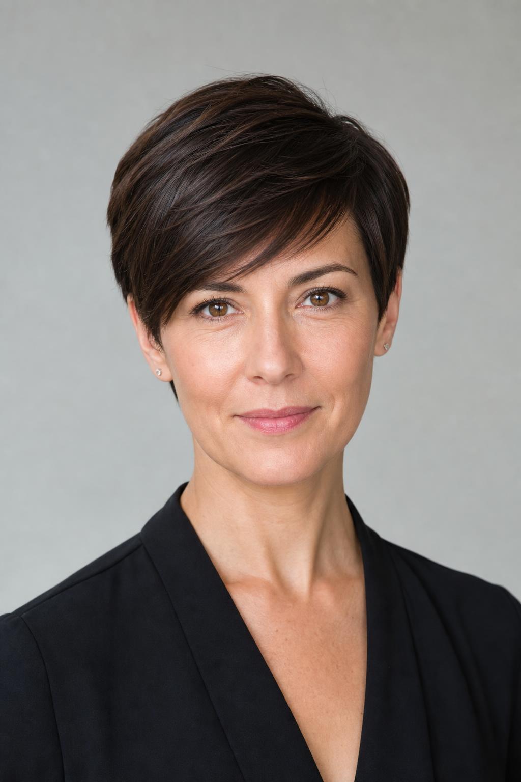 Tapered Pixie with a Long Front Section Swept Across the Forehead on Fine Dark Hair