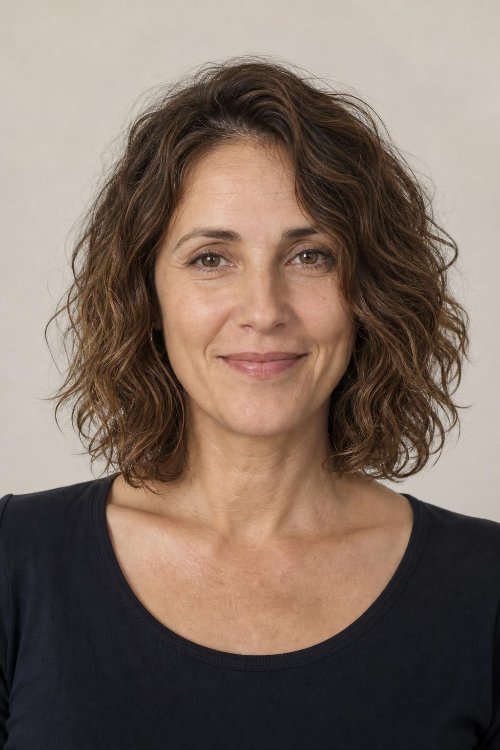 Collarbone-Length Cut on Naturally Wavy Low-Density Hair in Warm Brown