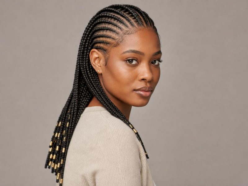 Center-Part Fulani-Inspired Tribal Braids with Gold Cuffs and Beaded Ends