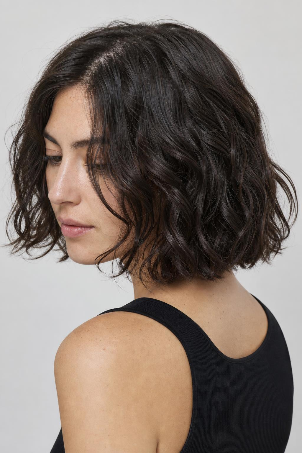 Wavy Bob with a Hidden Nape Undercut Lying Close at the Neck on Thick Hair