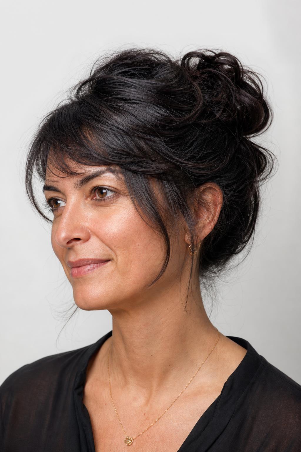 Loose Voluminous Bun Secured with Large Pins on Thick Coarse Dark Hair
