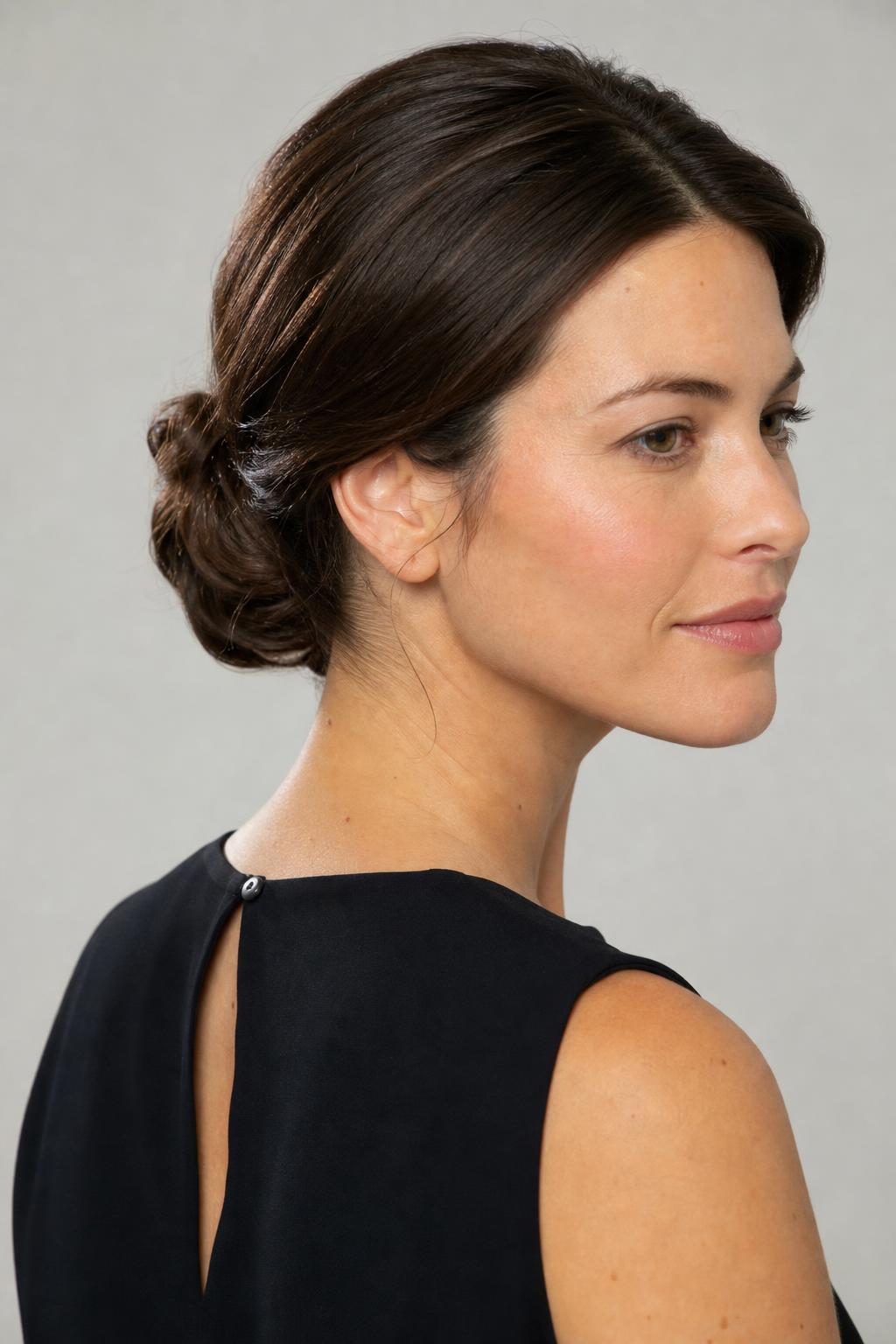 Smooth Low Chignon Rolled at the Nape on Long Dark Brown Hair