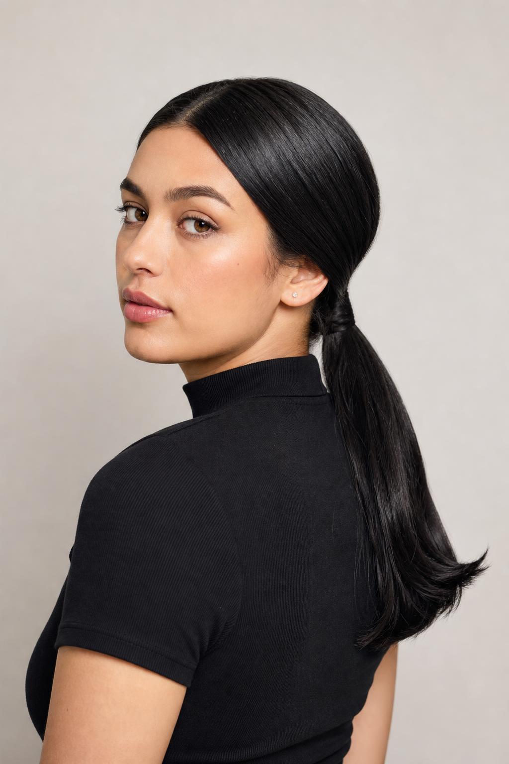 Sleek Low Ponytail with Hair Wrapped Around the Base on Straight Black Hair