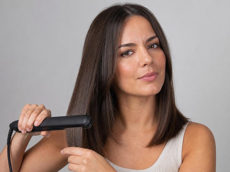 Smooth Straightened Shoulder-Length Brunette Hair Styled with a Ceramic Flat Iron