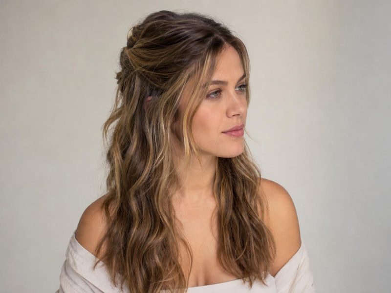 Boho Hair Worn as Loose Undone Waves With a Soft Half Up Twist