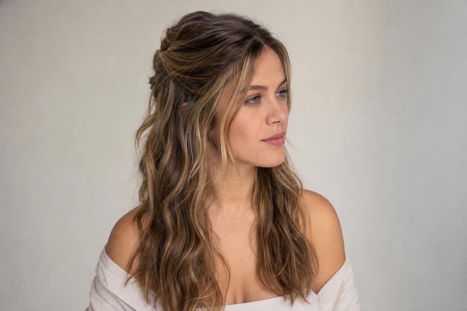 Boho Hair Worn as Loose Undone Waves With a Soft Half Up Twist