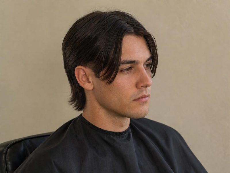 Middle Part Mullet With Curtain Front and Tapered Sides on a Man