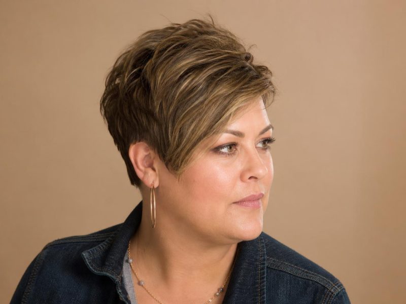 Textured Pixie Cut with Crown Volume and Longer Side-Swept Front on Fine Hair